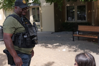 A parole officer talking with a child